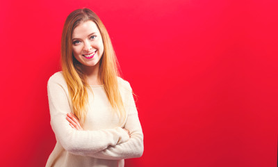 Obraz premium Happy young woman on a solid background