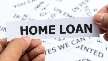 Home loan text or word meaning on paper in hand holding