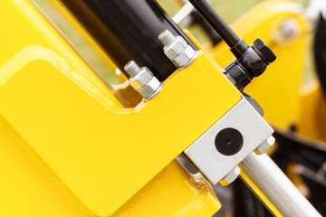 Screws, bolts and piston or actuator as part of agricultural machinery, technology and engineering concept