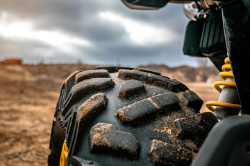 off-road ATV tire protector close-up in contour light, rubber texture © Denis