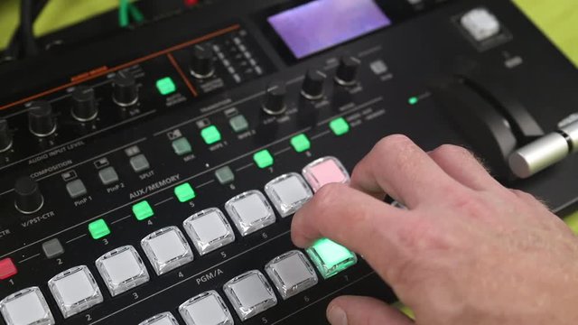 Hand operating video production switcher for live events