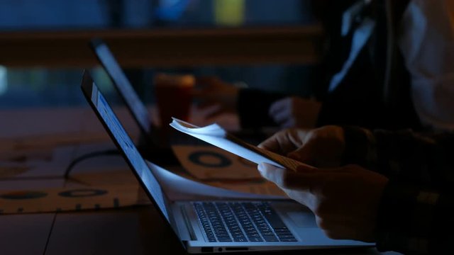 overworking deadline. office workaholics stay late at night to do business. employees at their workplaces in the evening