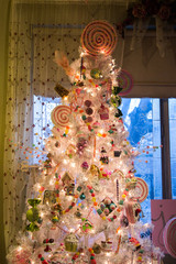 Obraz premium White Christmas Tree in front of window