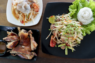 Papaya salad Thai Food (Som Tum) with grilled chicken and shrimp,Spicy delicious and healthy food...