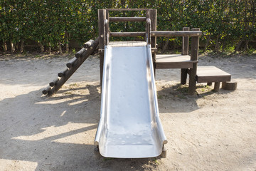 Simple wooden playground slide at a park of Tokyo, Japan.
