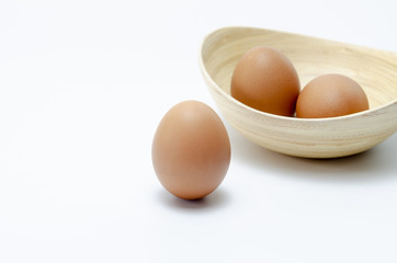 Fresh eggs in the bowl on the background