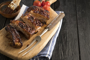 Roasted sliced barbecue pork ribs. Delicious barbecued ribs seasoned with a spicy basting sauce....