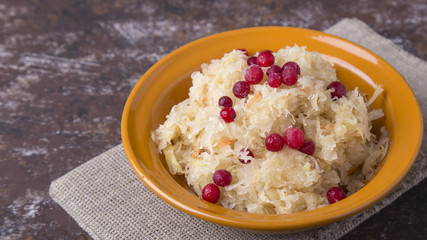 Juicy sauerkraut with berries in a plate
