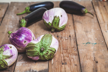 Several ripe eggplant varieties of bumbo lie on boards