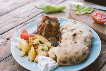 baked pork with potato and homemade bread