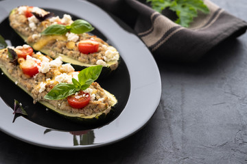Stuffed zucchini with meat and parsley. Copy space.