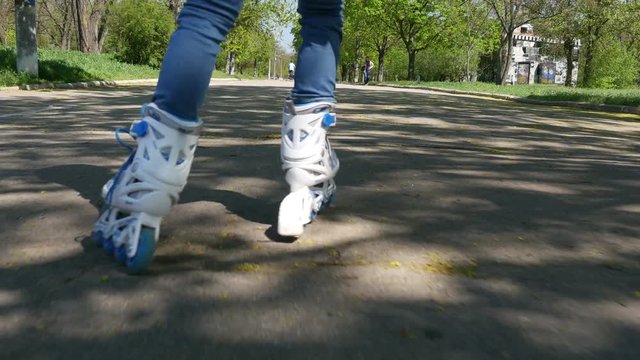 Teenage girl on roller skates in the park