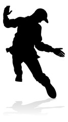 Fototapeta na wymiar A male street dance hip hop dancer in silhouette