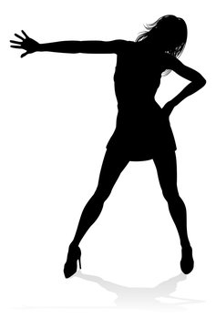 A woman dancer dancing in silhouette