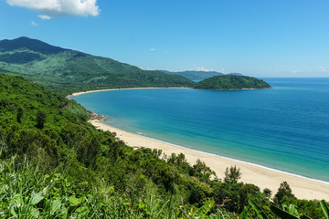 Faraway view of beautiful, clean, secluded beach in Vietnam on a sunny day