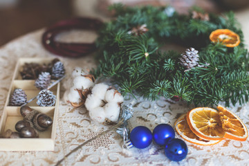 Obraz na płótnie Canvas The process of making handicraft christmas wreath