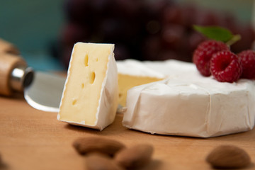 cheese camembert with raspberries and nuts, melange