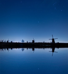 kinderdijk windmills by night - 221945504