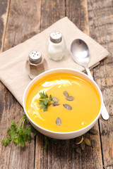 pumpkin soup on wood background