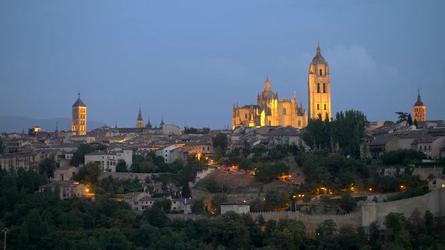 Panning night view of the city of Segovia, Cathedral of Santa Mar a and Church of San Esteban