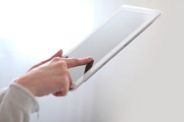 close up.woman's hand pressing on screen digital tablet .photo with copy space