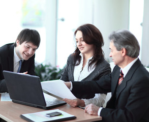 boss and staff in discussing the working paper