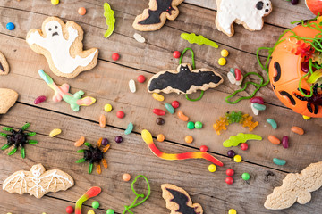 Halloween candies on wood table - holiday background