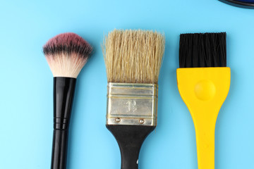 A some cosmetic brushes and one brush for painting walls.