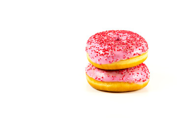 two fresh sweet pink donut with red sprinkles