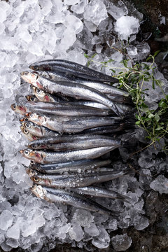Raw anchovies with salt and lemon
