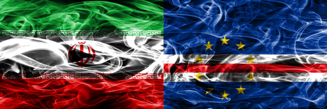Iran vs Cape Verde smoke flags placed side by side. Thick colored silky smoke flags of iranian and Cape Verde.