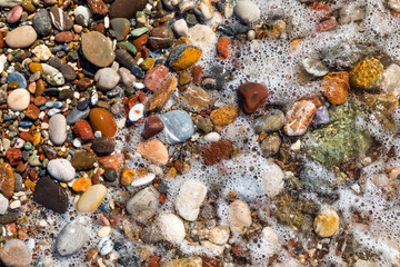 Beautiful pebbles on the beach close up