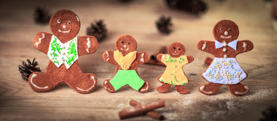 gingerbread men and cinnamon sticks on the Christmas table .