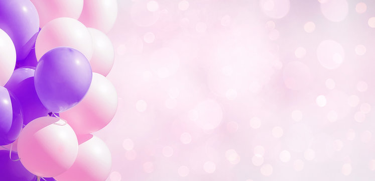Frame of pastel party balloons on soft background