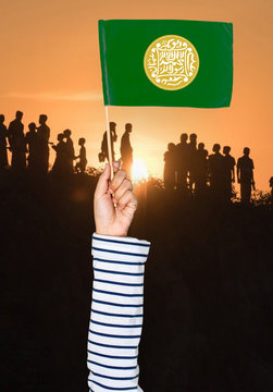 Rohingya woman holding national flag of Arakan Rohingya