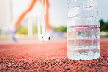 Drinking water bottle and Earphone for runners.