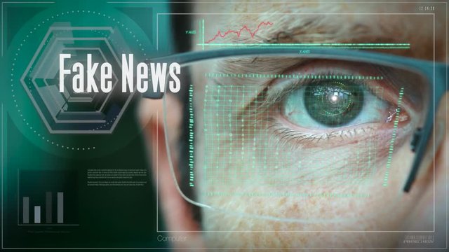 A close up of a businessman eye controlling a futuristic computer system with an Fake News concept.