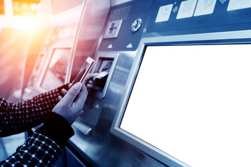 finance, money, bank and people concept - close up of hand entering pin code at atm machine