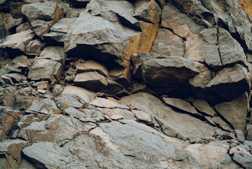 gray relief background of stone structure close-up