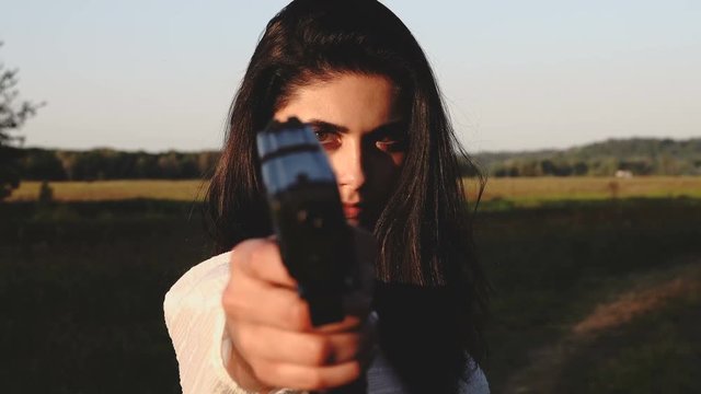 girl defends aiming gun.
