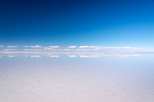Miror effect and reflection of clouds in Salar de Uyuni (Uyuni salt flats), Potosi, Bolivia, South America