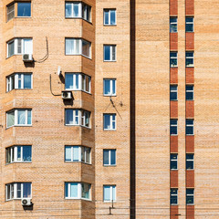 Obraz premium detail of facade of urban brick apartment building