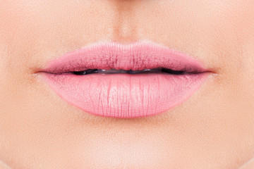 Beautiful female lips with pink lipstick makeup