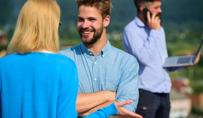 Couple having fun while busy businessman speak on phone. Couple happy flirting while man tense with mobile conversation. Face to face conversation advantages concept. Partners glad to see each other