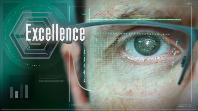 A close up of a businessman eye controlling a futuristic computer system with an Excellence concept.