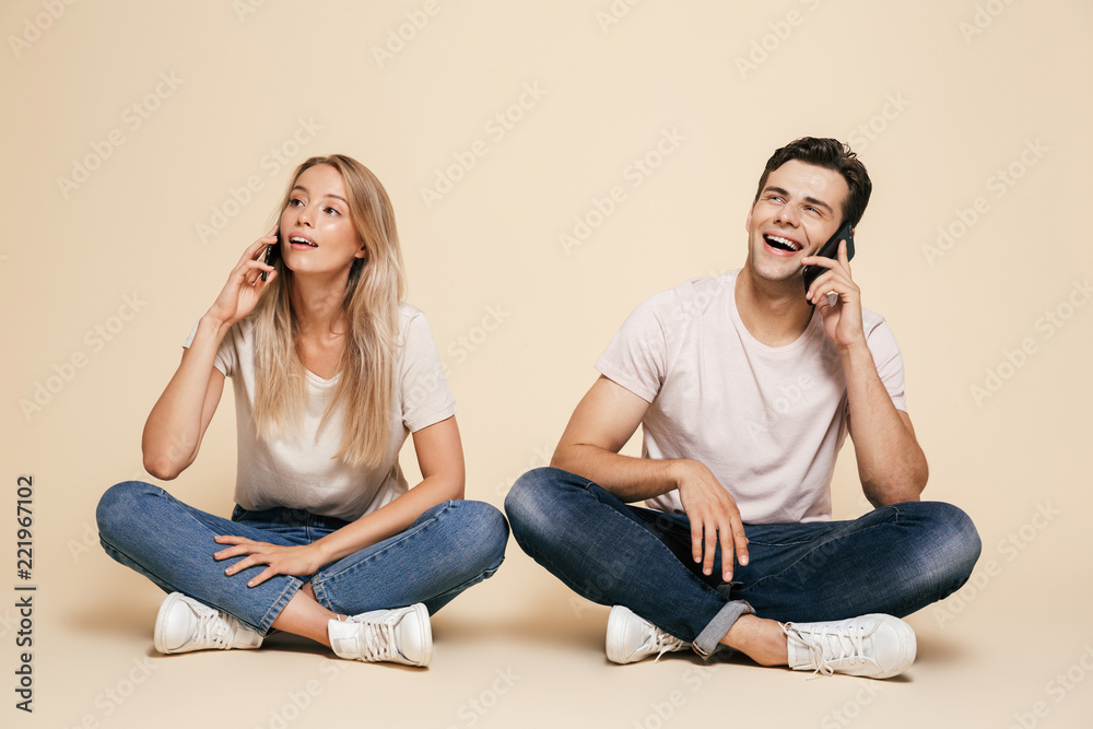 Canvas Prints Portrait of a happy young couple sitting together