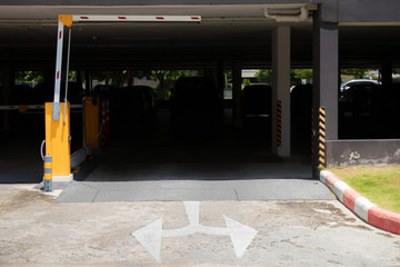 car park barrier, automatic entry system.Security system for building access - barrier gate stop with toll booth, traffic cones and cctv