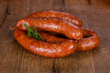 Pork sausages over wooden