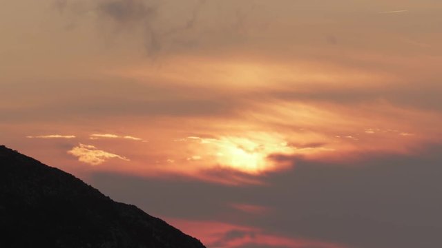 a firey vivid sunset in hte picos de europa, asturia, spain