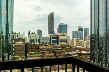 Fototapeta na wymiar Abu Dhabi city skyline and towers on a cloudy day - WTC and the mall